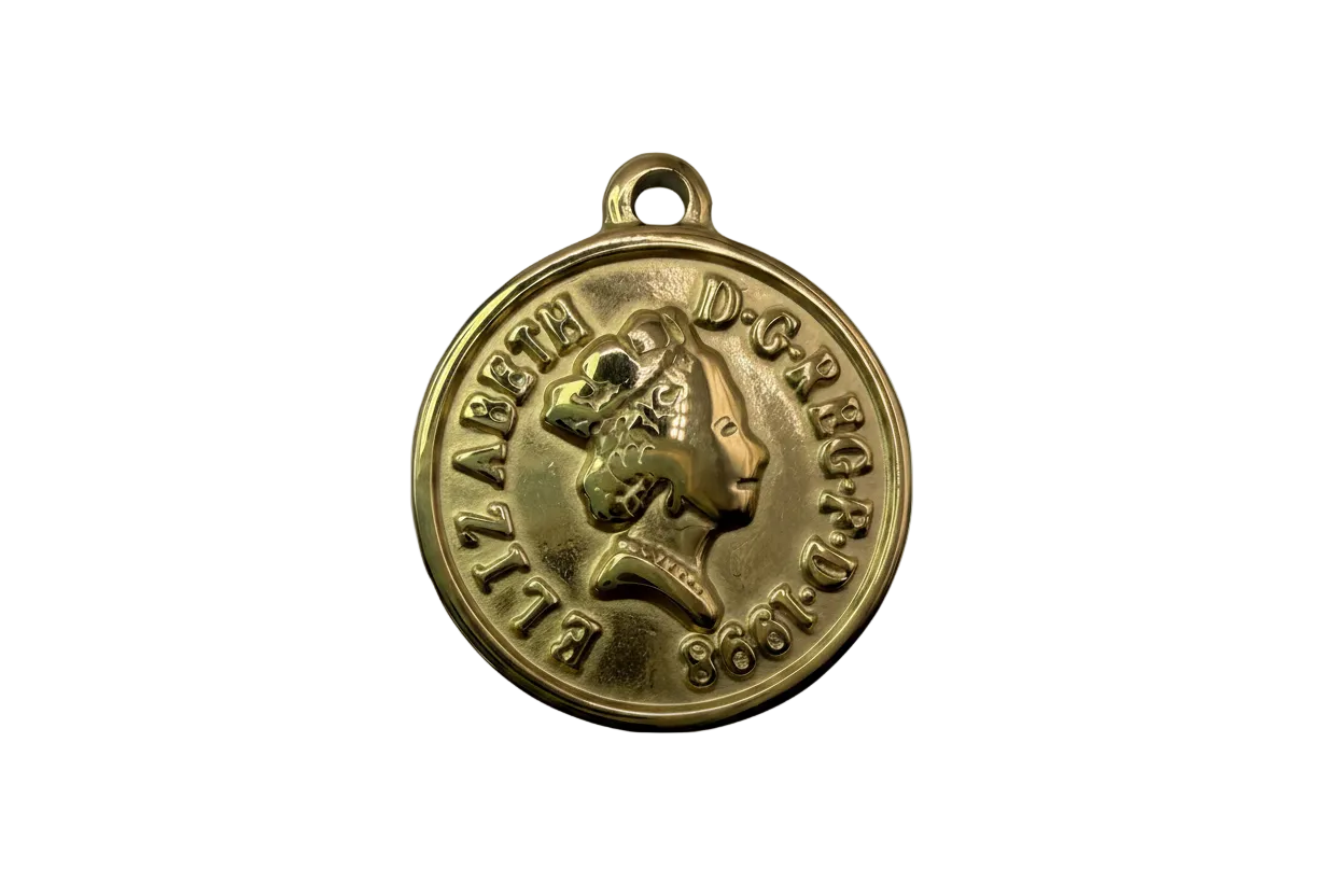 Gold round coin-style medallion with raised profile portrait and embossed lettering, dated 1968