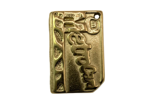 Gold rectangular plaque charm with embossed espresso lettering and textured side details