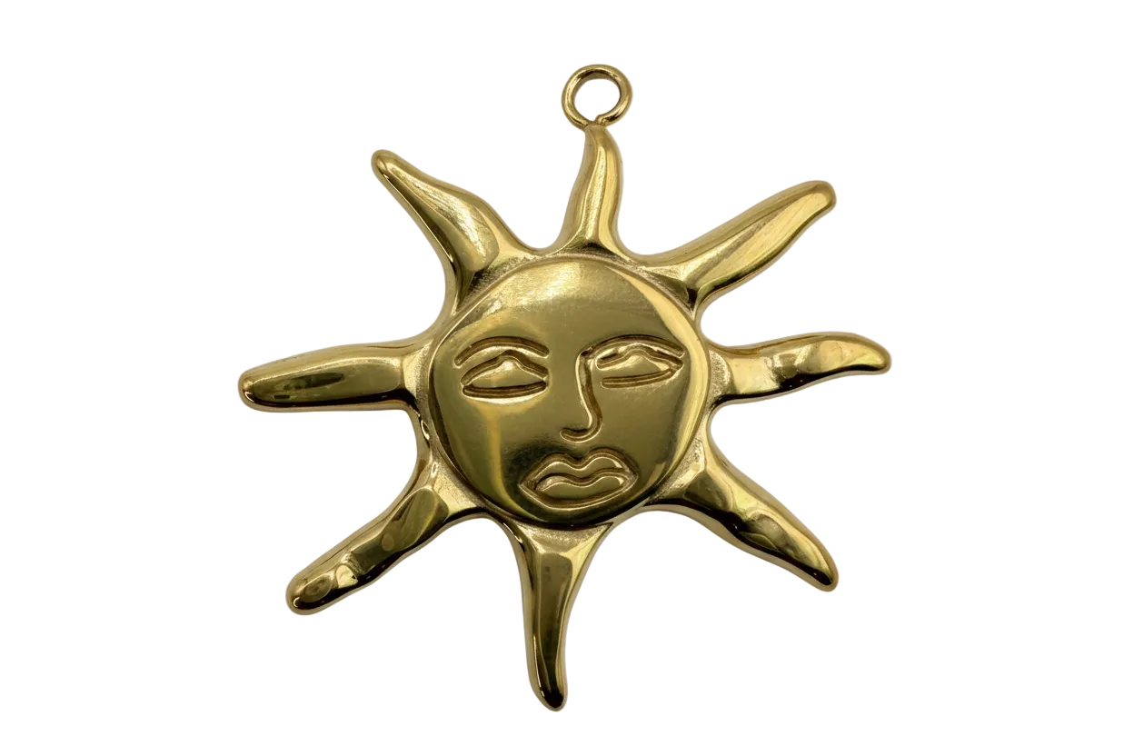Polished gold sun face charm with radiating rays and sculpted features