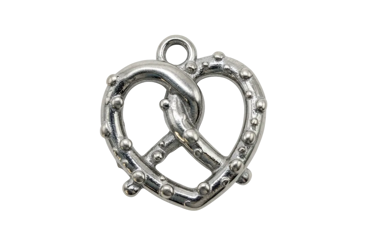 Polished silver pretzel charm with raised salt-like bead texture