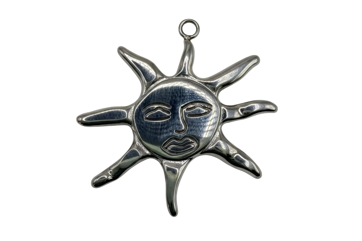 Polished silver sun face medallion with elongated rays and engraved facial details
