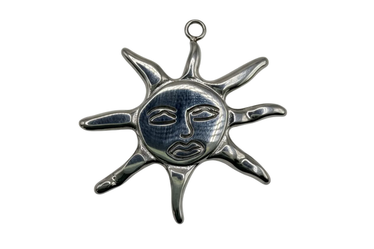 Polished silver sun face medallion with elongated rays and engraved facial details