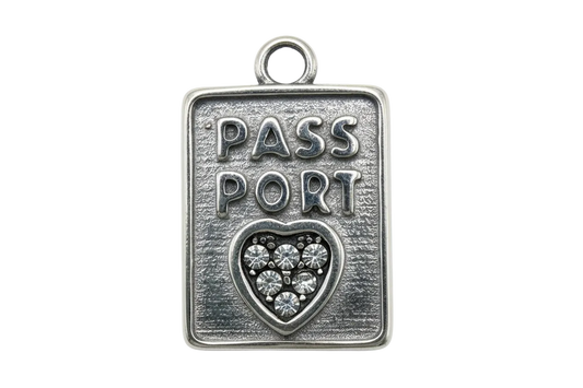 Antique-silver passport tag with raised PASS PORT text and heart filled with clear crystals