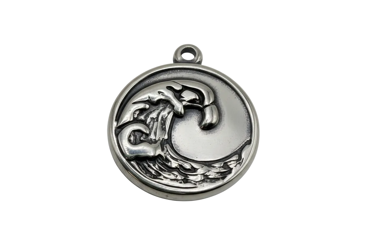 Silver-toned round medallion with raised mushroom and crescent moon motif in an antiqued finish