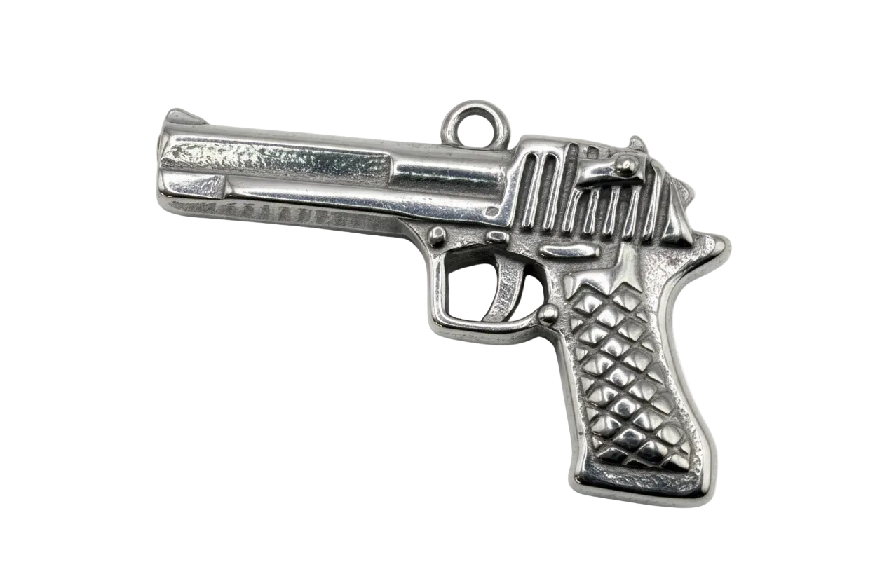 Polished silver pistol-shaped charm with textured grip and engraved detail