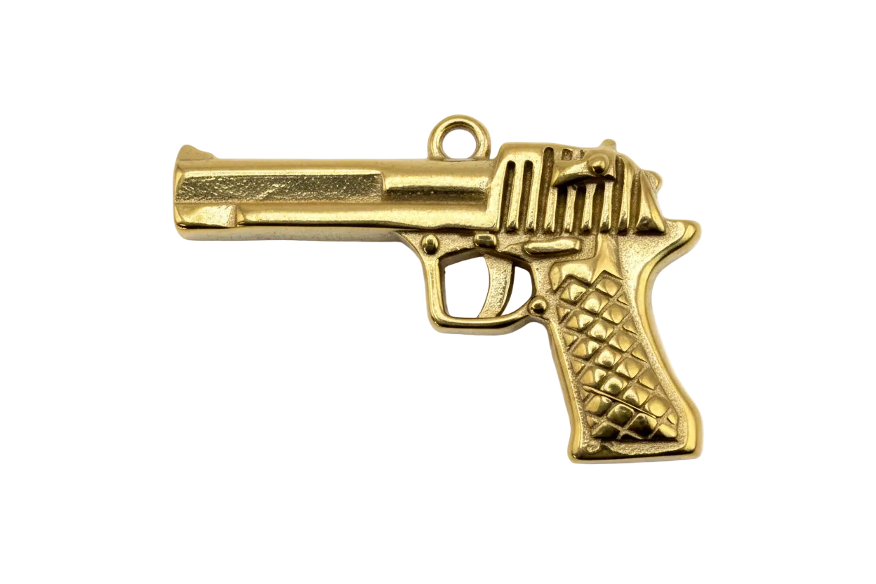 Gold pistol charm with textured grip and ridged slide detailing