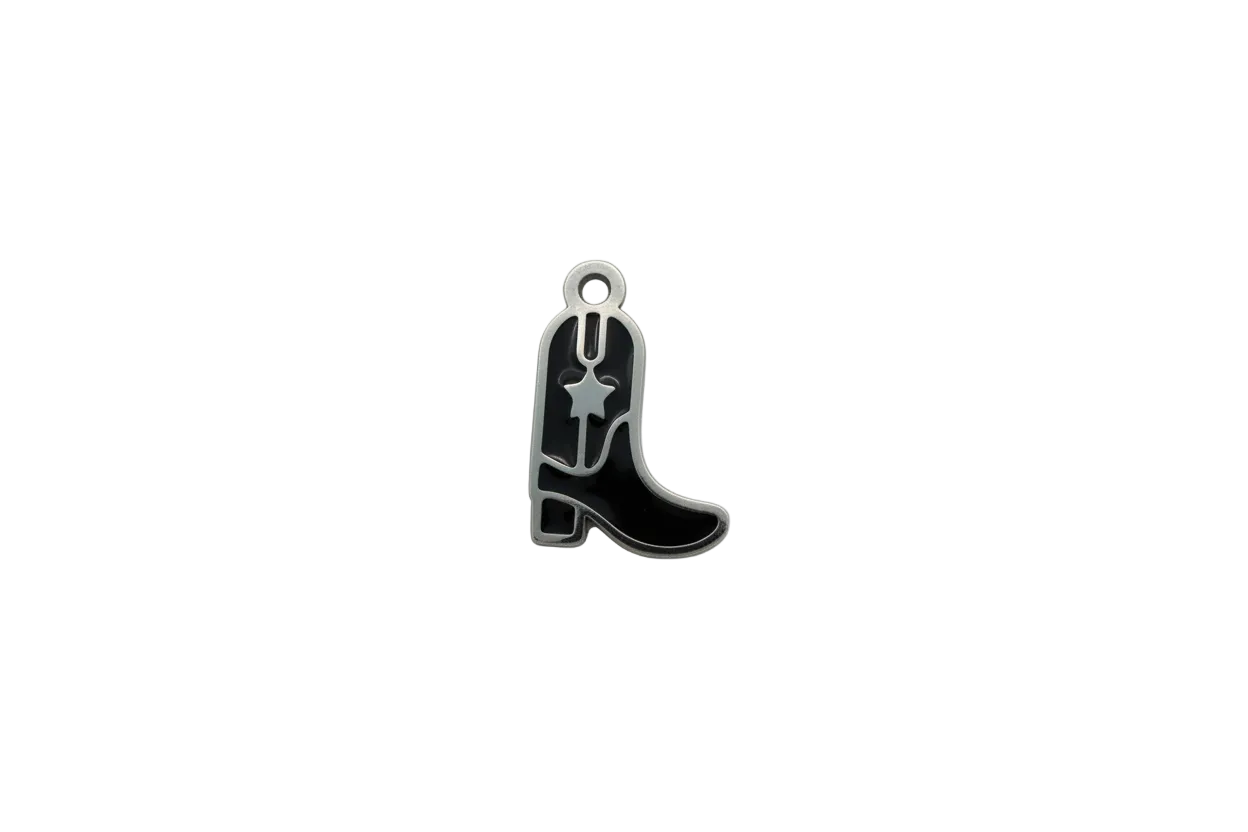 Silver cowboy boot with black enamel and star spur