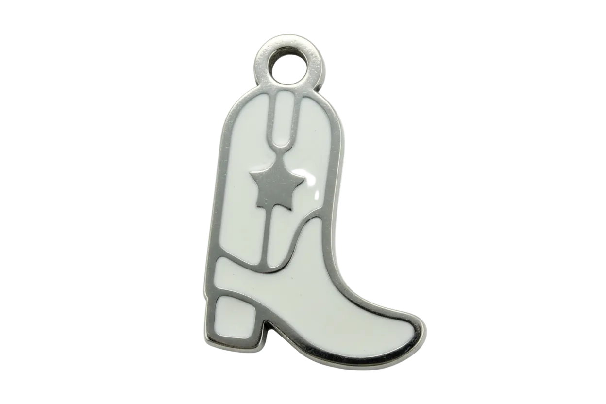 White enamel cowboy boot charm with dark metal outline and star cutout detail
