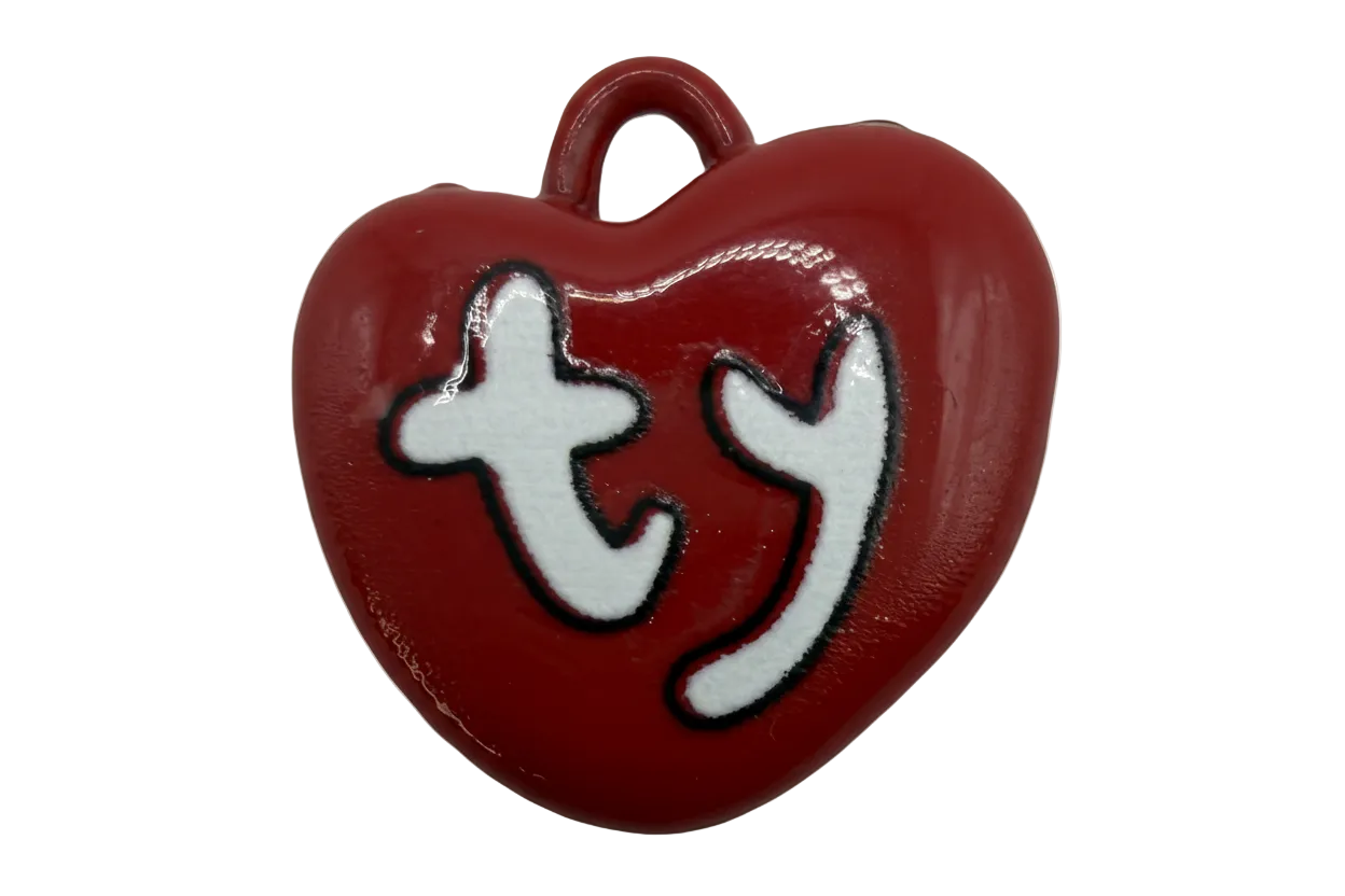 Glossy red heart charm with white “ty” lettering outlined in black