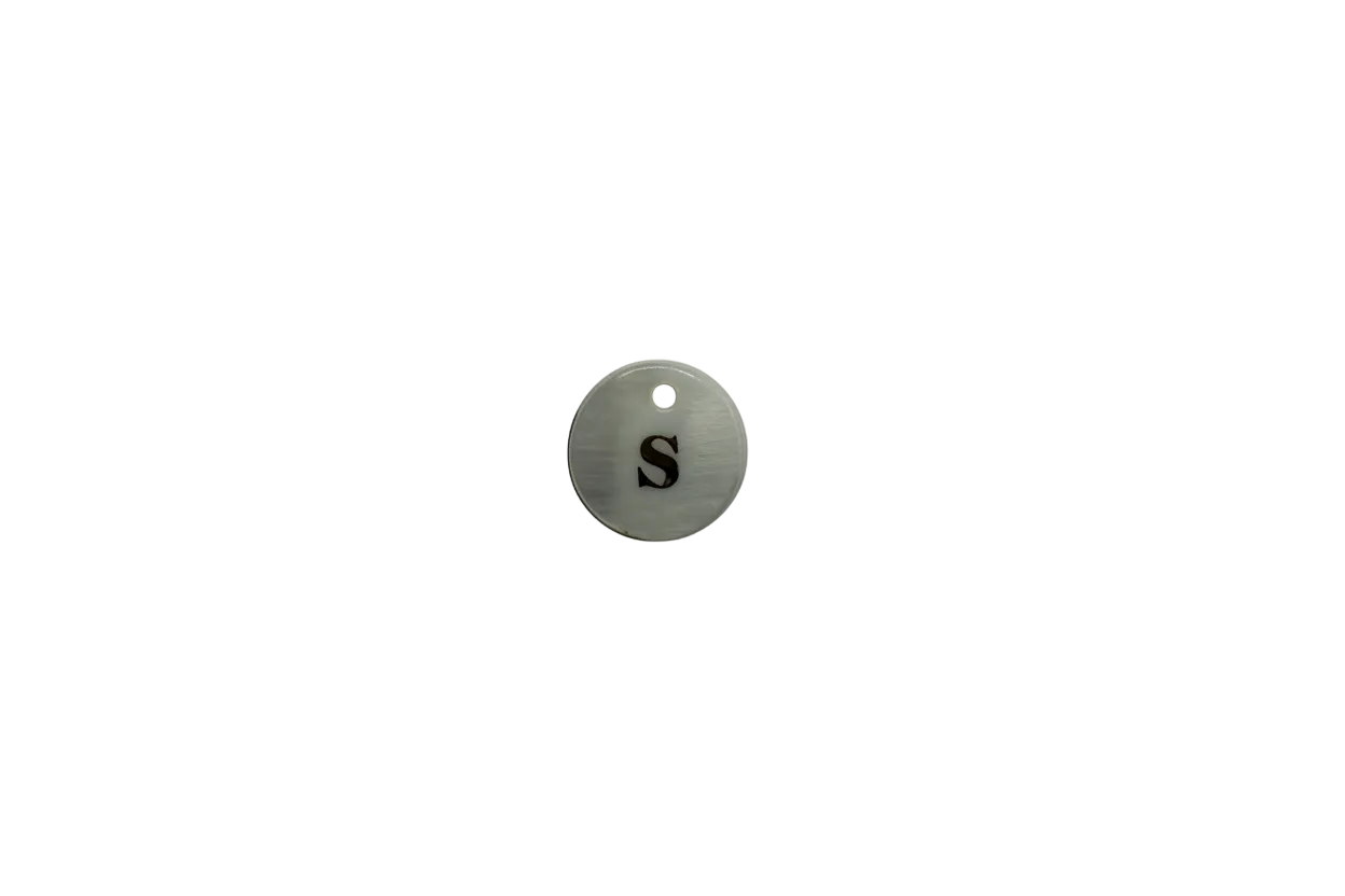 White round disc with polished gold letter S