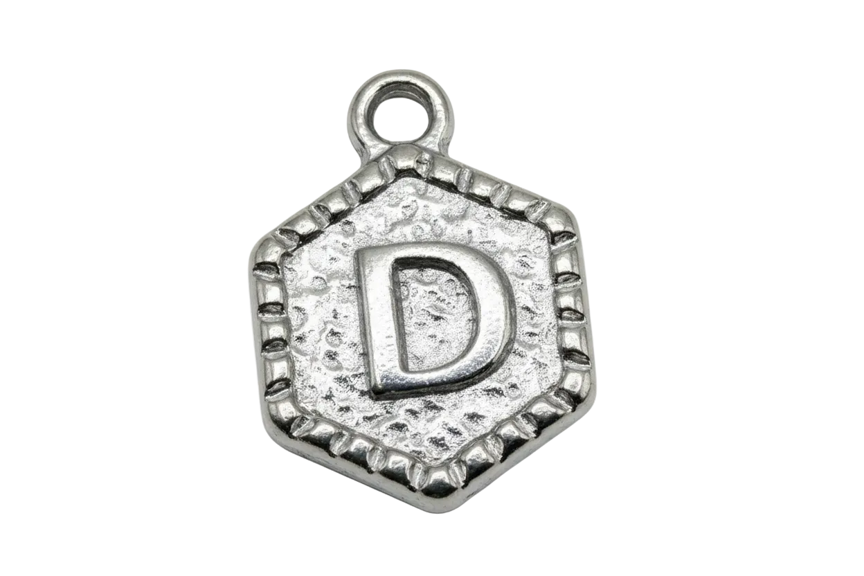 Antiqued silver hexagon medallion with raised letter D and textured background