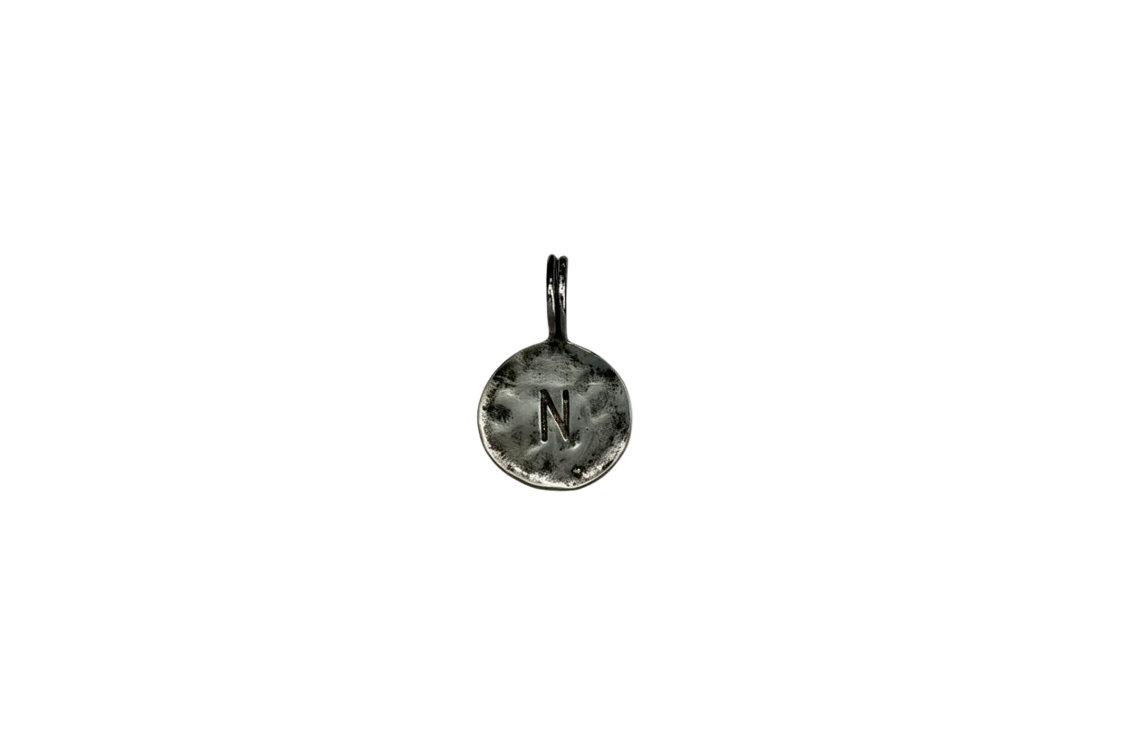 Hammered silver coin with stamped letter N