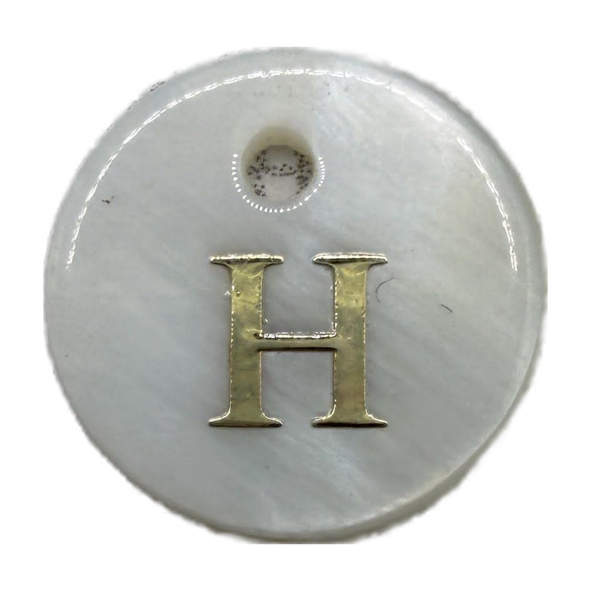Glossy white round disc with gold letter H