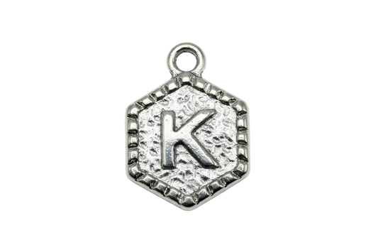 Antiqued silver textured medallion with raised letter K and sculpted border