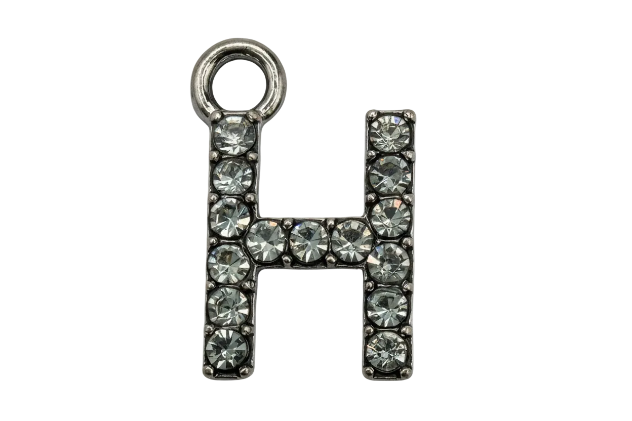 H initial outlined with pavé clear crystals on silver-toned metal