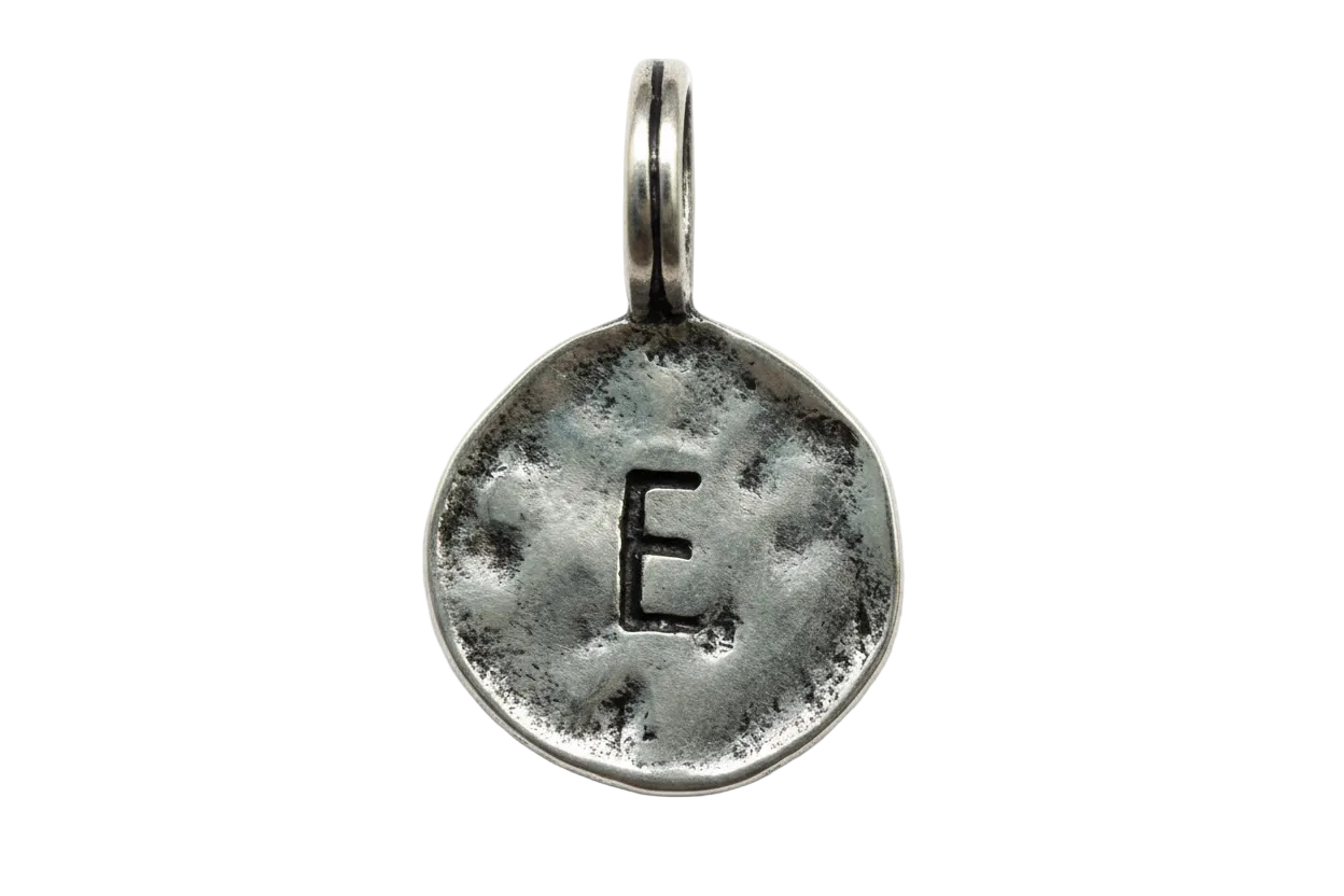 Antiqued silver round coin with stamped letter E
