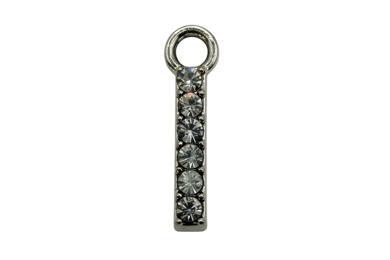 Silver-tone pavé crystal bar charm with six clear round stones