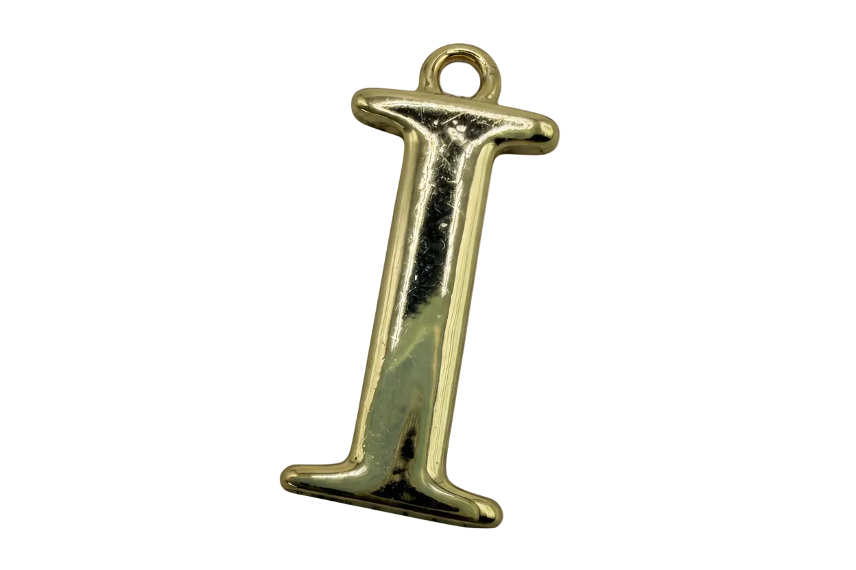 Polished gold letter I with serif styling on black background