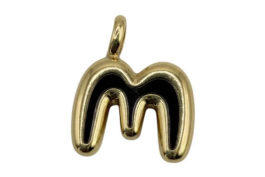 Polished gold letter M initial with rounded sculpted shape on black background