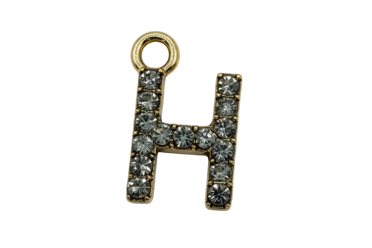 Gold letter H charm with clear faceted stones in a pavé layout