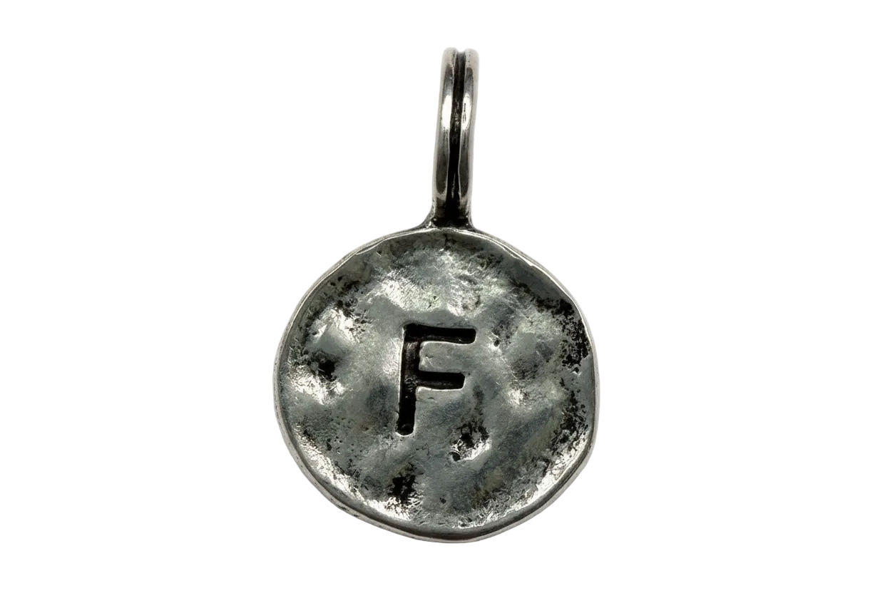 Antiqued silver round coin disc with hammered texture and letter F cutout