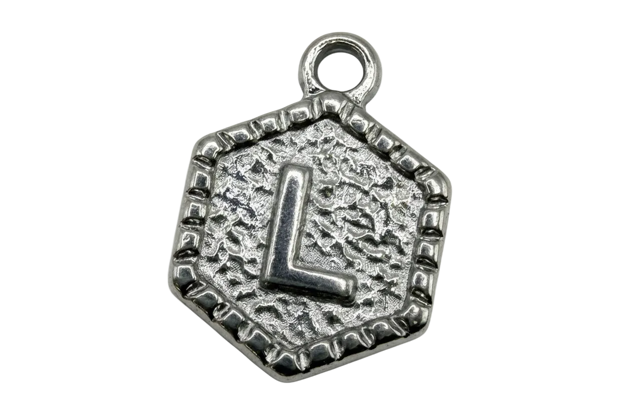 Silver-tone hexagon medallion with raised letter L and textured background
