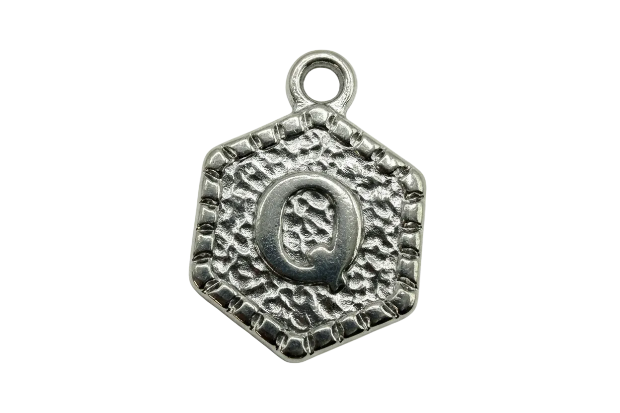 Antique silver square tile with textured surface and raised letter Q