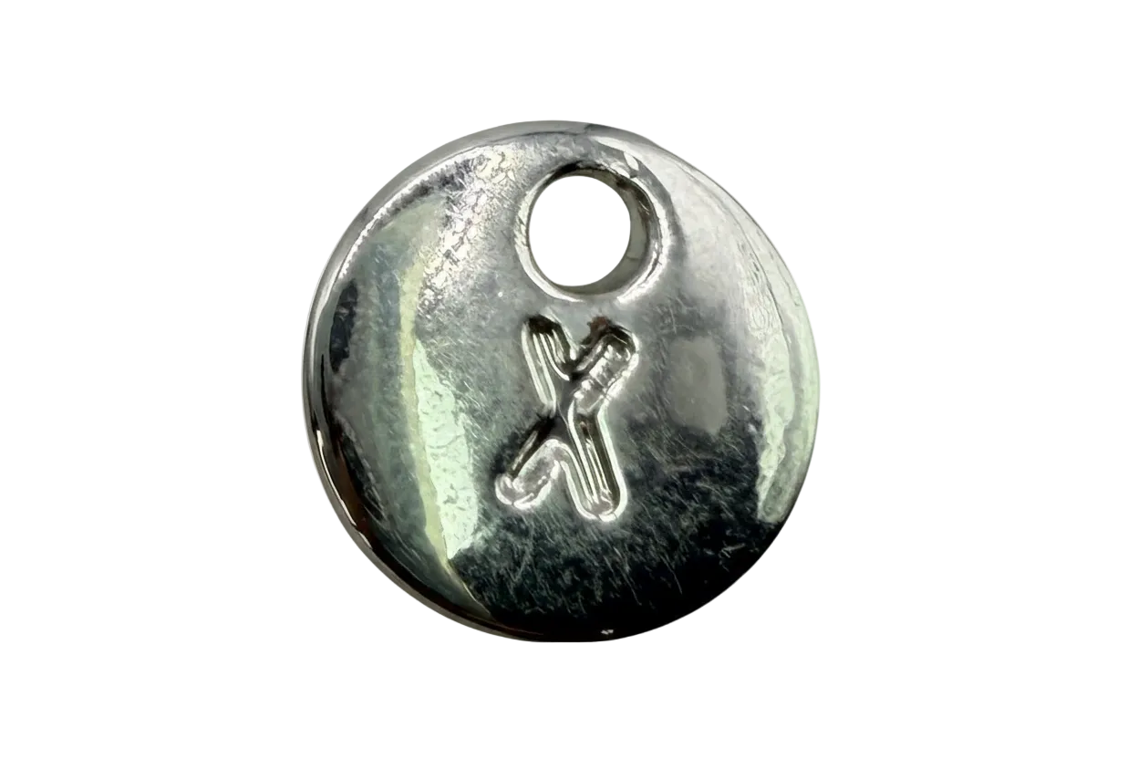 Polished silver round disc with raised initial X detail