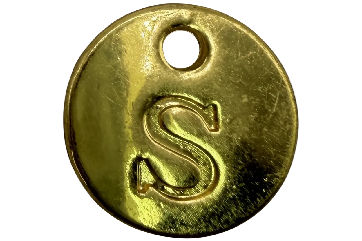 Polished gold coin disc with embossed letter S and small top hole