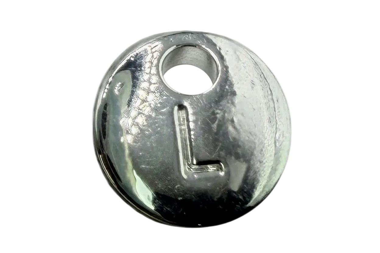 Polished silver round coin charm with raised letter L and small clear gem accent