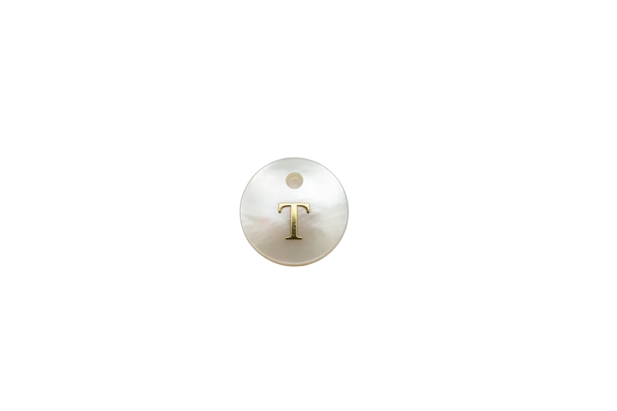 Iridescent white disc with raised gold letter T