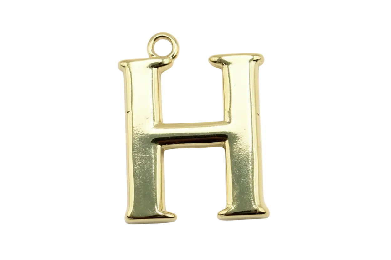 Polished gold serif letter H initial with glossy finish