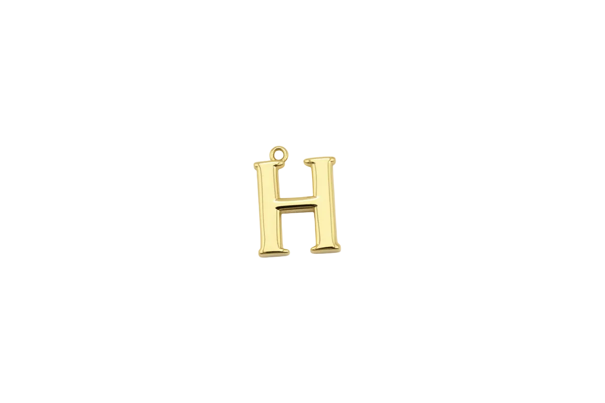 Gold serif letter H initial, glossy finish