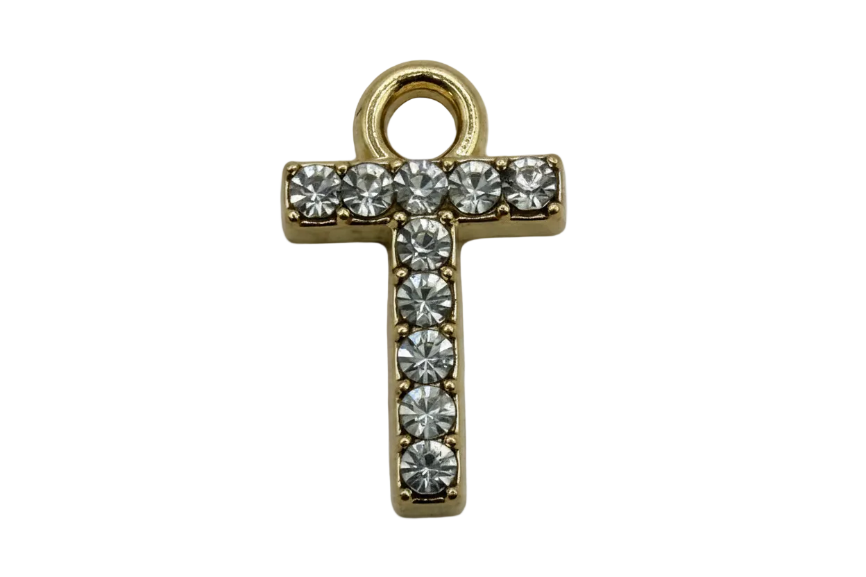 Gold pavé cross with clear faceted stones