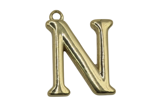 Gold puffed letter N initial with a small clear gem accent