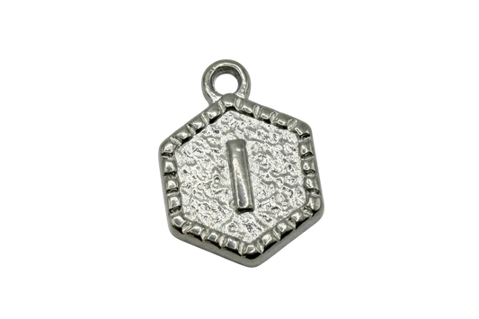 Textured silver hexagon tag with raised initial letter I and antiqued border