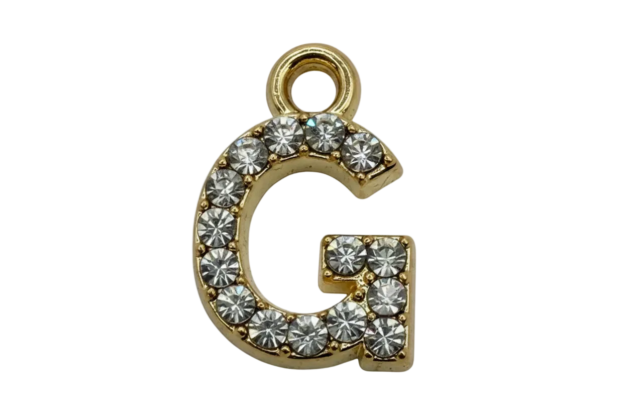 Gold pavé initial G with clear round gems