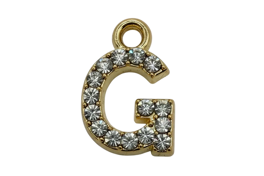 Gold pavé initial G with clear round gems