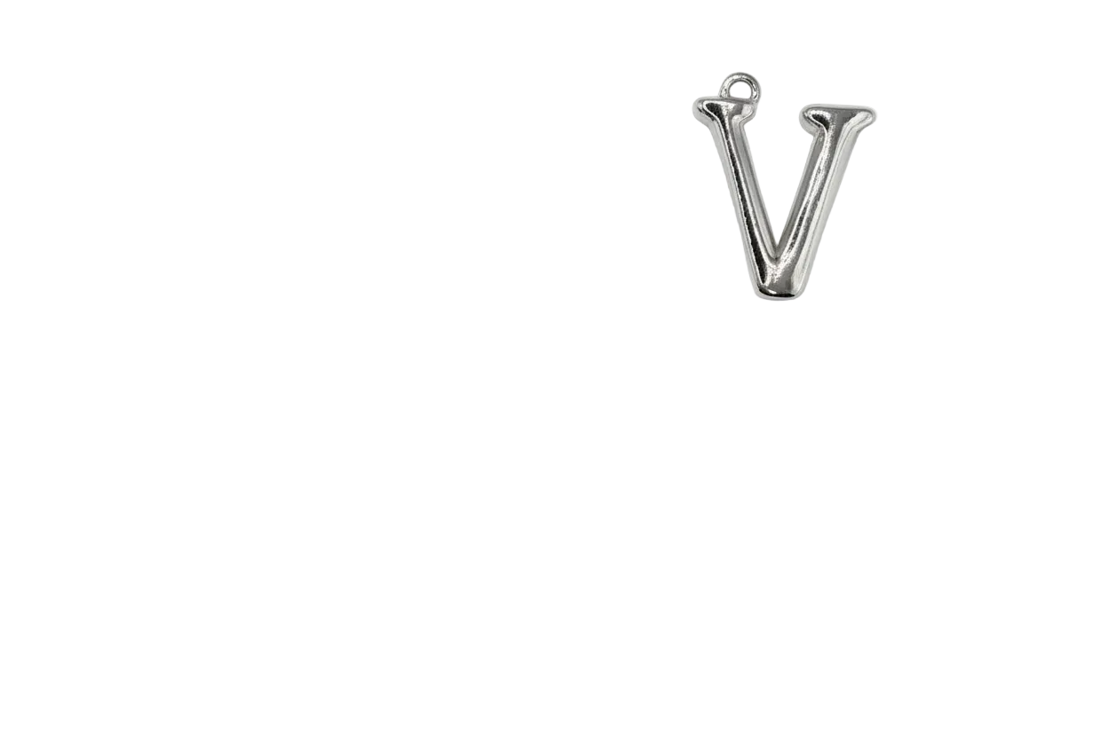 Polished silver letter V charm on black background
