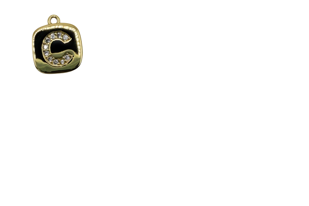 Gold rounded square tile with black enamel and pavé letter C in clear crystals