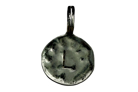 Antiqued silver round initial coin featuring a recessed letter L