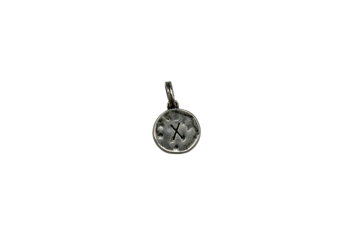 Antiqued silver coin disc with letter X cutout