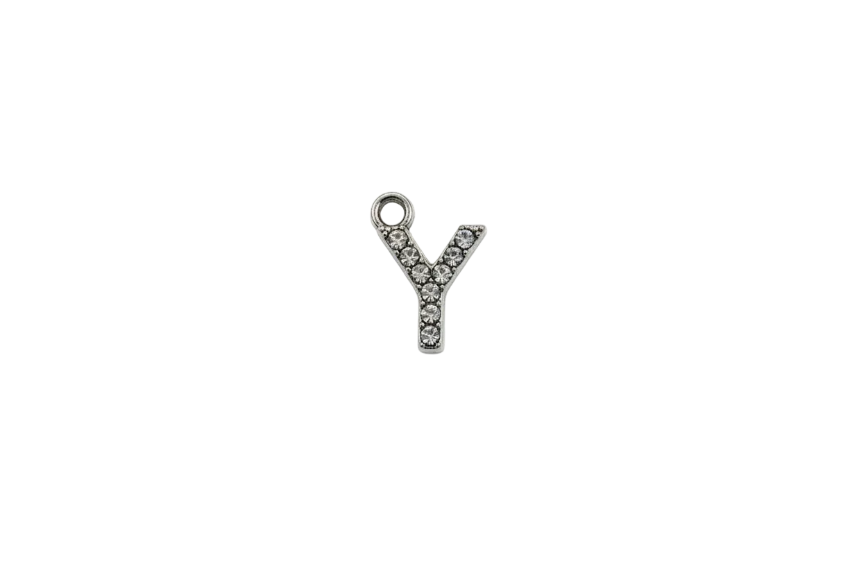 Silver pavé letter Y initial with clear crystals on a black background