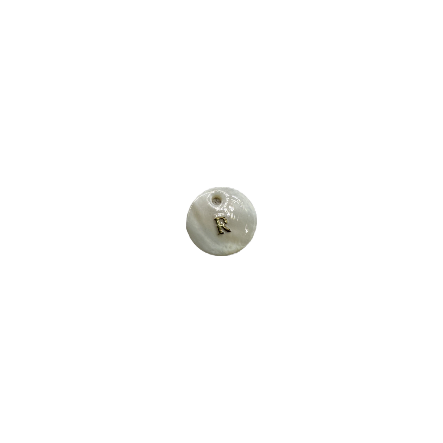 White disc with raised gold letter R