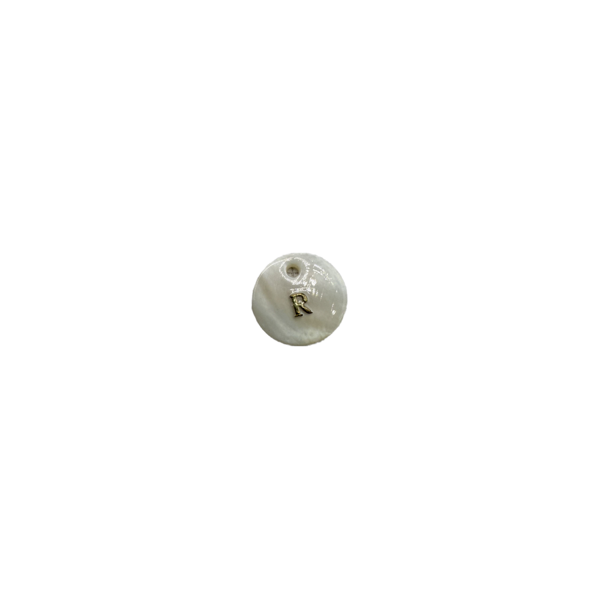 White disc with raised gold letter R