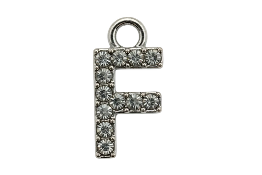 Silver letter F initial with pavé clear crystals on a black background