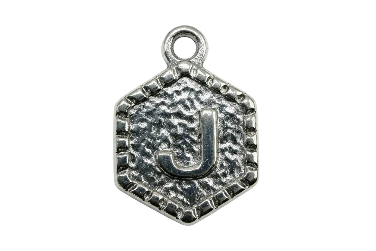 Antique silver textured medallion with raised letter J and framed edge
