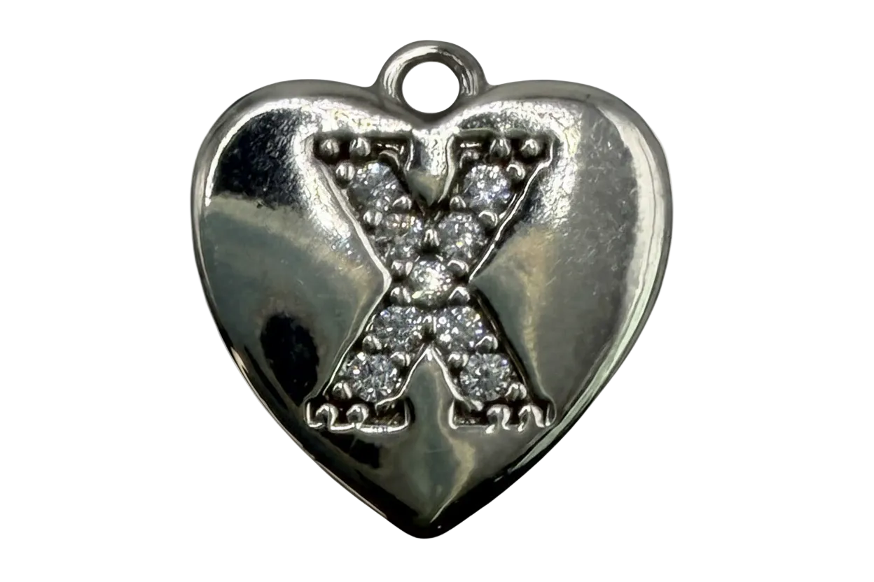 Polished silver-tone heart with a pavé crystal letter X in the center