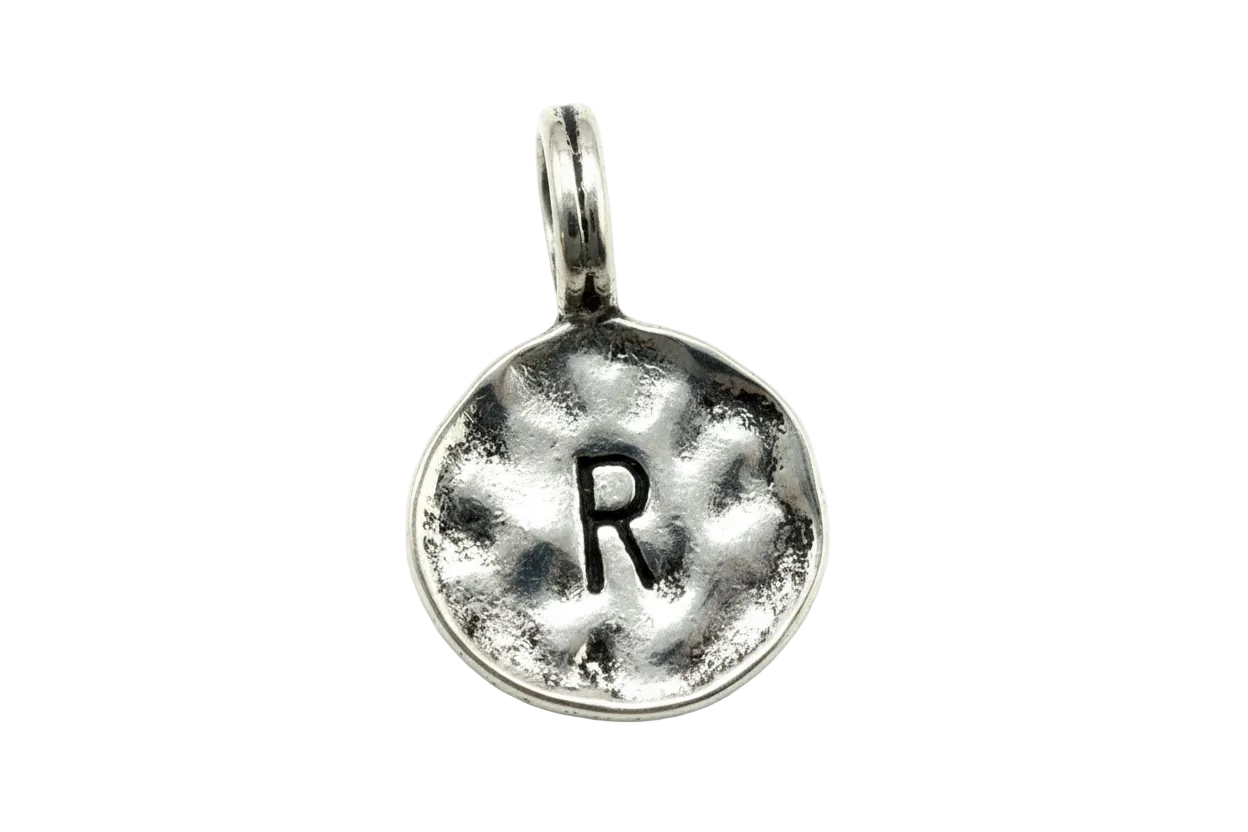 Hammered silver coin pendant with stamped letter R and antiqued detailing