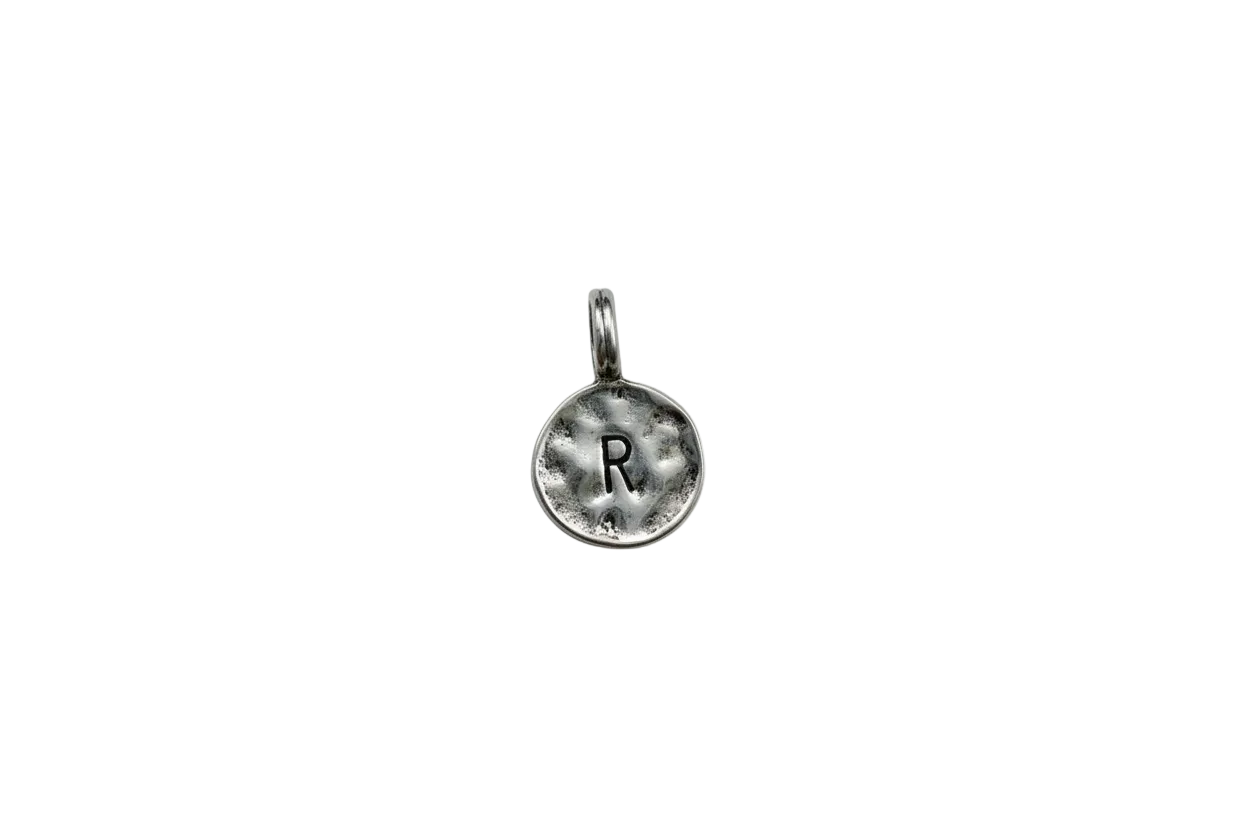 Hammered silver coin with stamped letter R